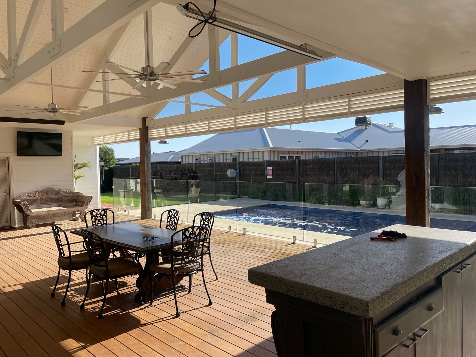 Covered outdoor entertaining area and pool by CIB Constructions